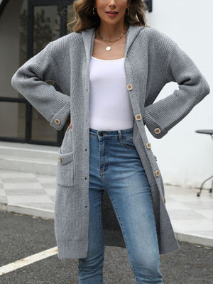 Longline gray knit cardigan with hood, buttons, and pockets.