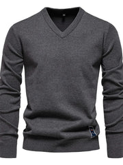 Dark Gray ribbed knit V-neck sweater with a small logo tag on the hem.