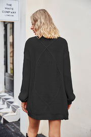 Black cable knit cardigan with diamond pattern detail on back, acrylic.