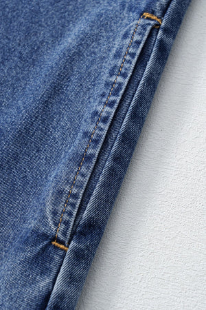 Light blue denim mini dress with visible pocket detail and contrast stitching.