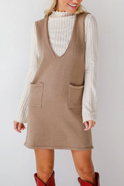 Camel knit sleeveless V-neck dress with two front pockets.