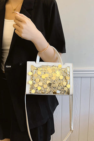 White structured mini bag with gold sequin embellishments and clear panel