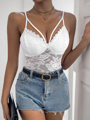 White floral lace crossover bodysuit with strappy neckline and scalloped trim