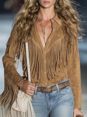 Brown suede bohemian jacket with fringe detail and button front, styled with jeans.