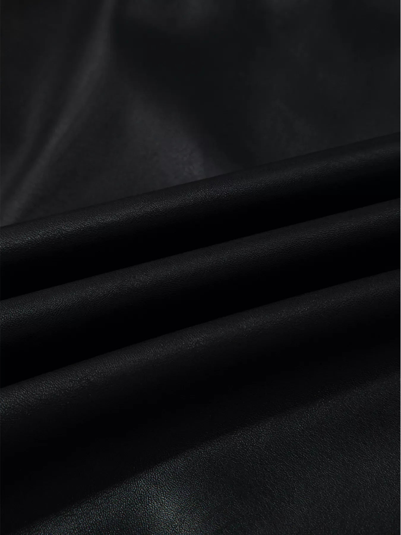 Black vegan leather sleeveless mini dress fabric detail