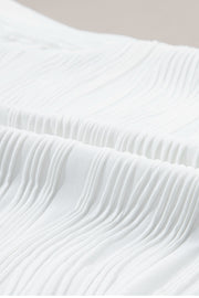 White textured wave cap-sleeve mock neck top detail