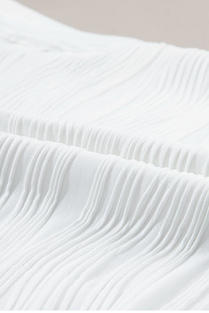 White textured wave cap-sleeve mock neck top detail