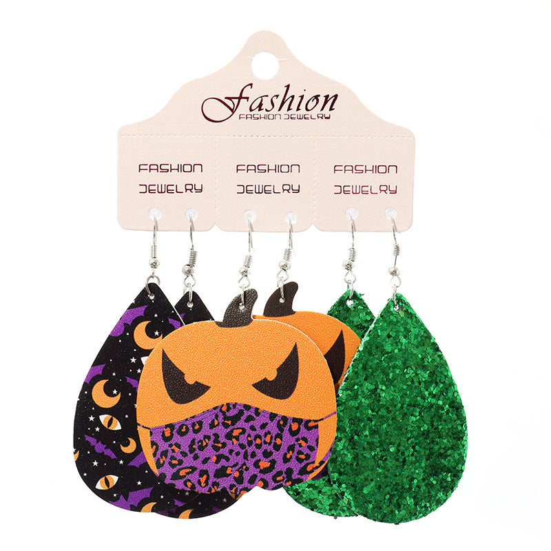 Spooky Halloween dangle earrings set with pumpkins, bats, moons, and green glitter teardrops.