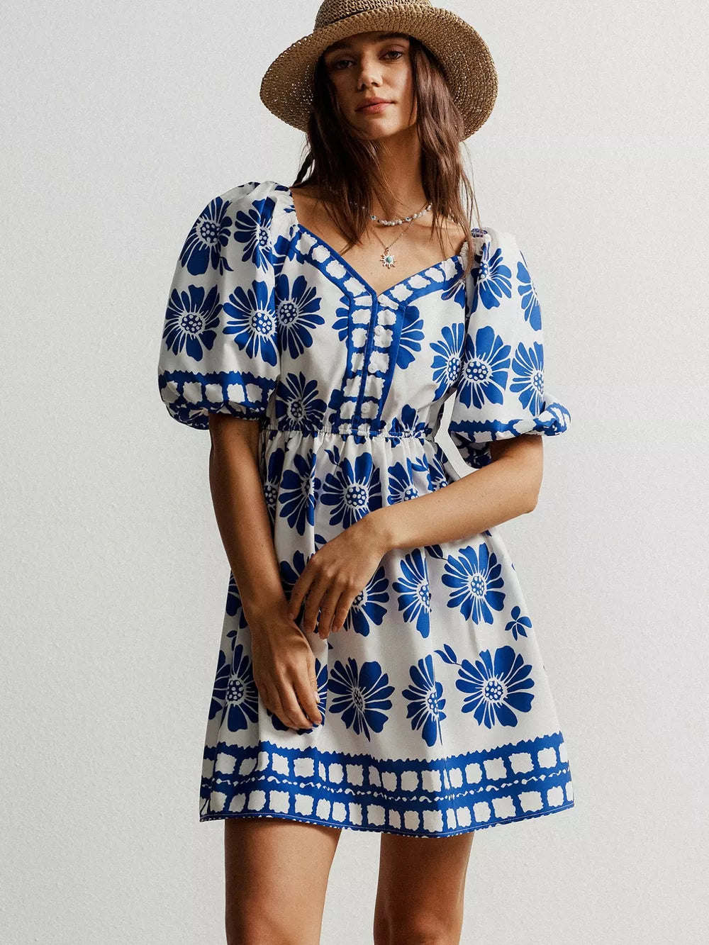 Blue floral puff sleeve mini dress with V-neck and button detail