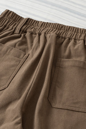 Seamed front wide leg trousers in caramel with elastic waistband and back pockets.