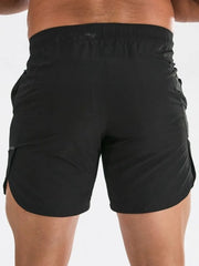 Black athletic shorts with quick-dry fabric and a sculpted fit.