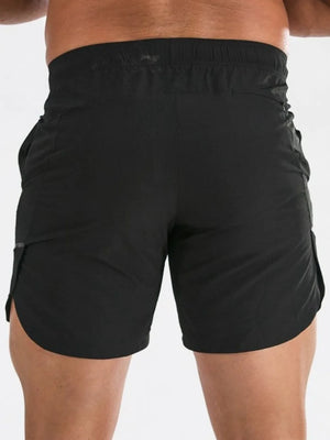 Black athletic shorts with quick-dry fabric and a sculpted fit.