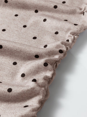 Boat neck polka dot long-sleeve tee in khaki with a textured knit fabric and gathered hem detail.