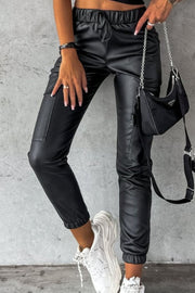 Black faux leather cargo joggers with elasticated waist and drawstring, cuffed ankles.