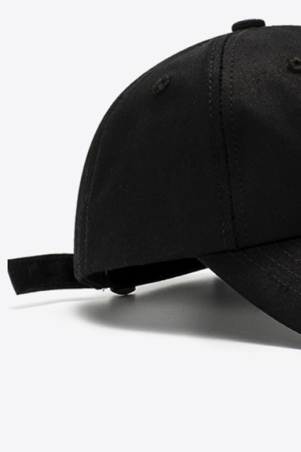 Black cotton baseball cap with adjustable strap detail