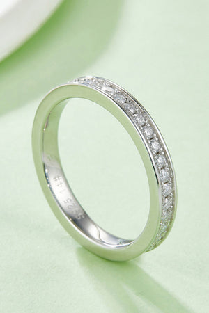Silver pavé moissanite eternity band ring with 925 sterling silver marking.
