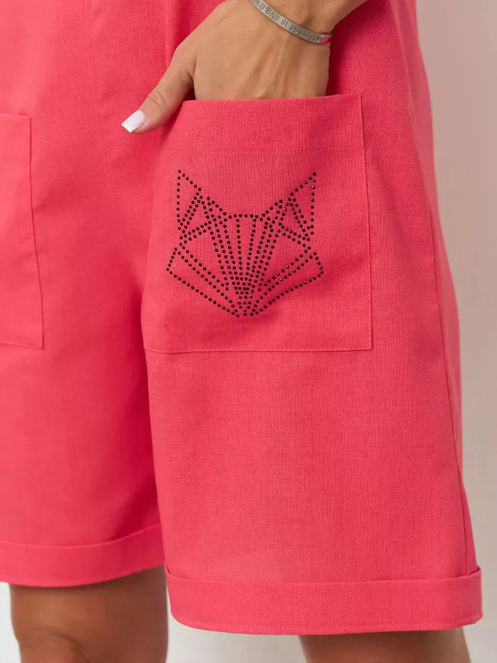 Cotton romper in red with a rhinestone fox pocket detail and cuffed hem.