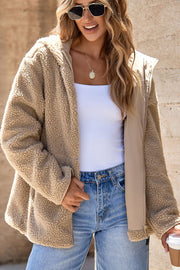 Sherpa lined hooded jacket in beige with contrast lining and zip closure.