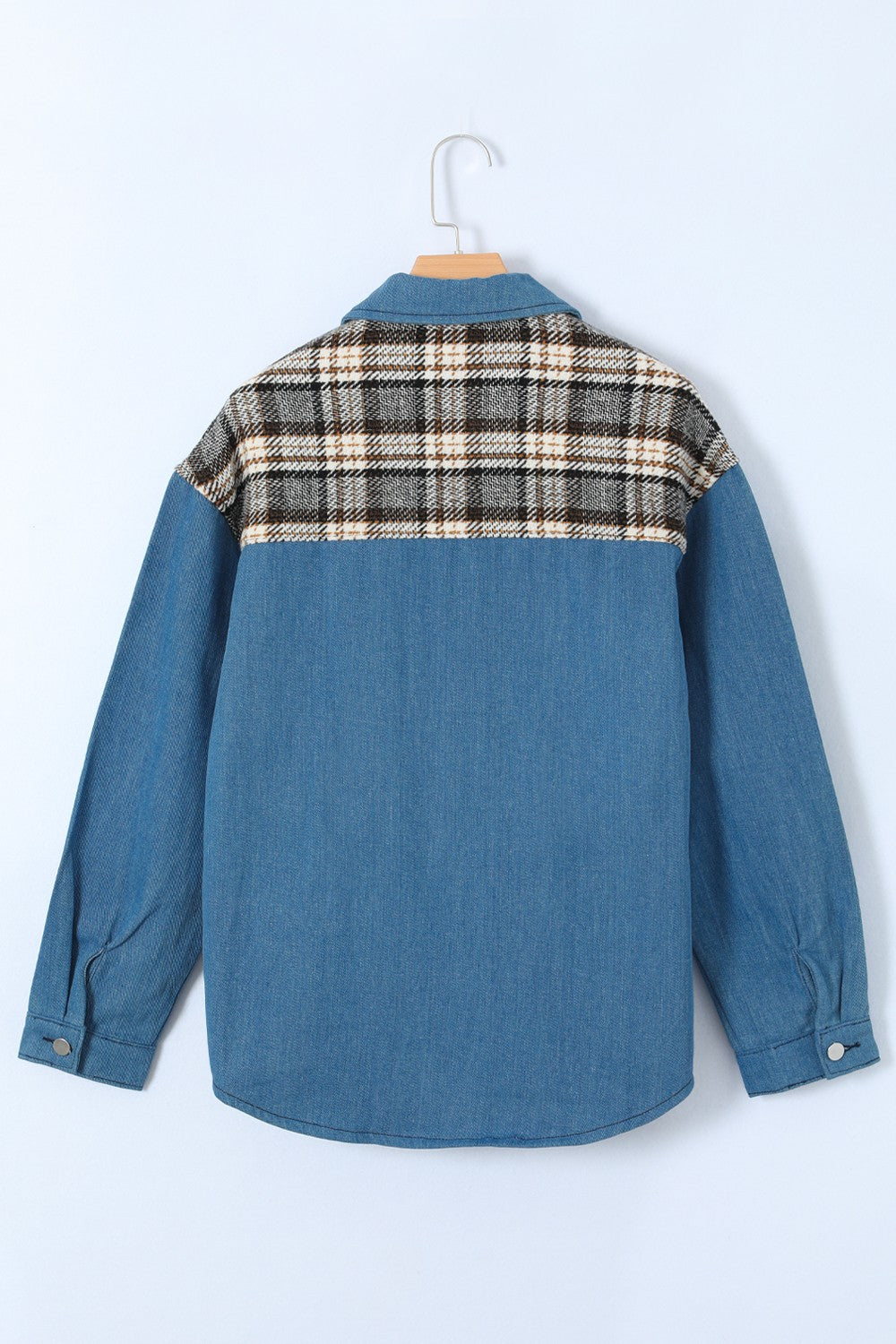 Light blue denim shirt jacket with plaid panel detail on the back yoke.