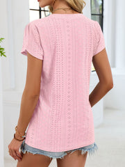 Pink eyelet v-neck tee with petal short sleeves and textured pattern.