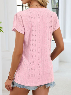Pink eyelet v-neck tee with petal short sleeves and textured pattern.