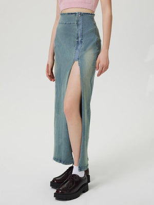 Denim maxi skirt in medium wash with a high waist, front zipper, and high slit.