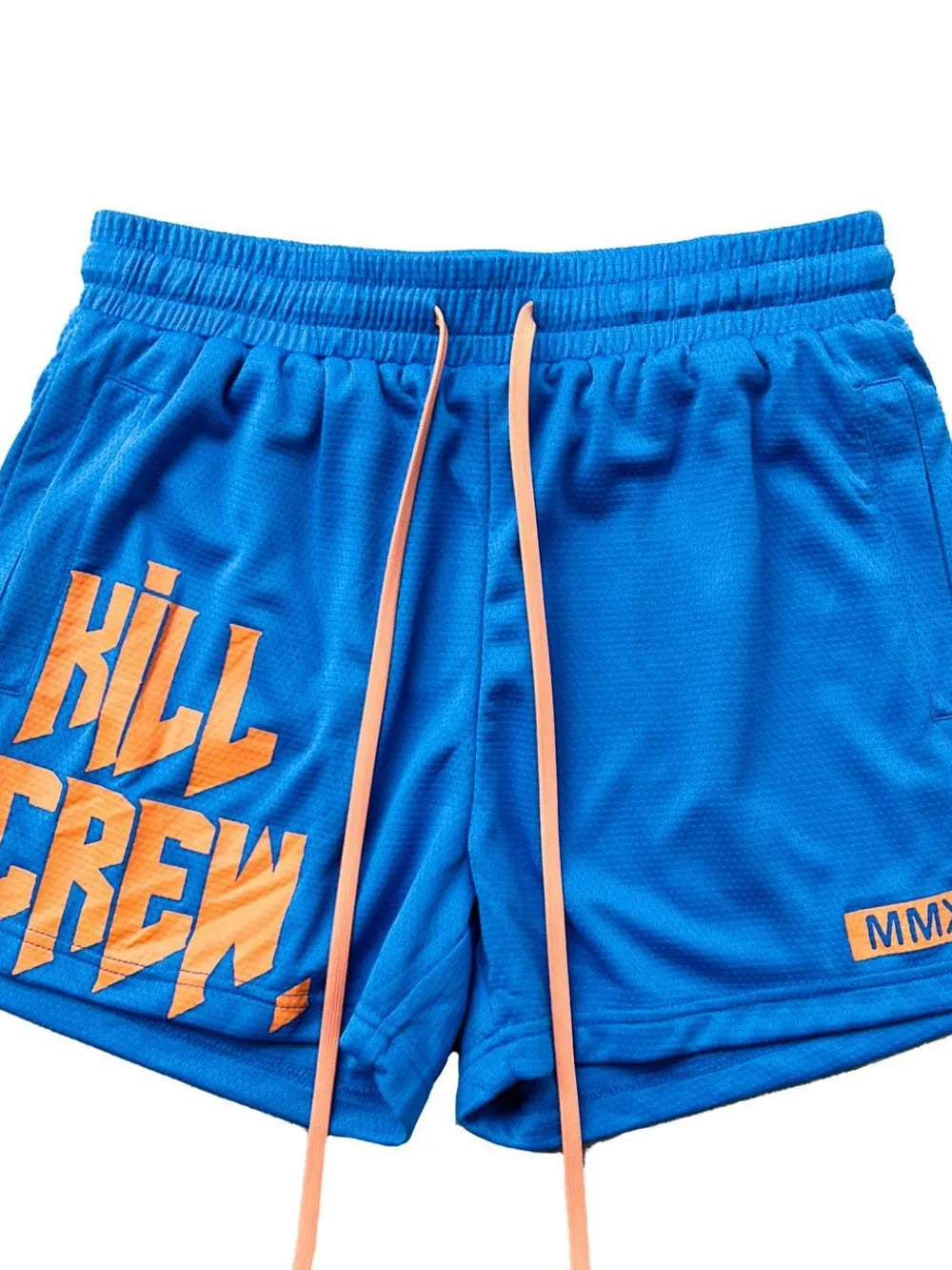 Blue performance shorts with orange "KILL CREW" graphic and drawstring.