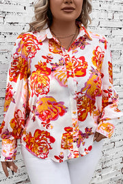 Blouse with blouson sleeves in a bold floral print, featuring a collared neckline and button-up front.