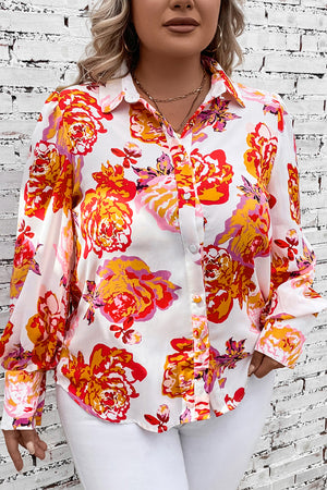 Blouse with blouson sleeves in a bold floral print, featuring a collared neckline and button-up front.