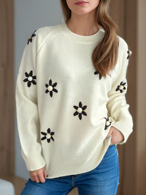 Cream embroidered floral raglan knit sweater with beaded flower details.