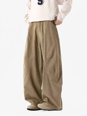 Men's taupe vintage wide-leg sweatpants with curved seam details.