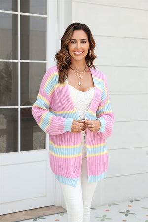 Open knit cocoon cardigan with rainbow stripes in pink, blue, and yellow acrylic.