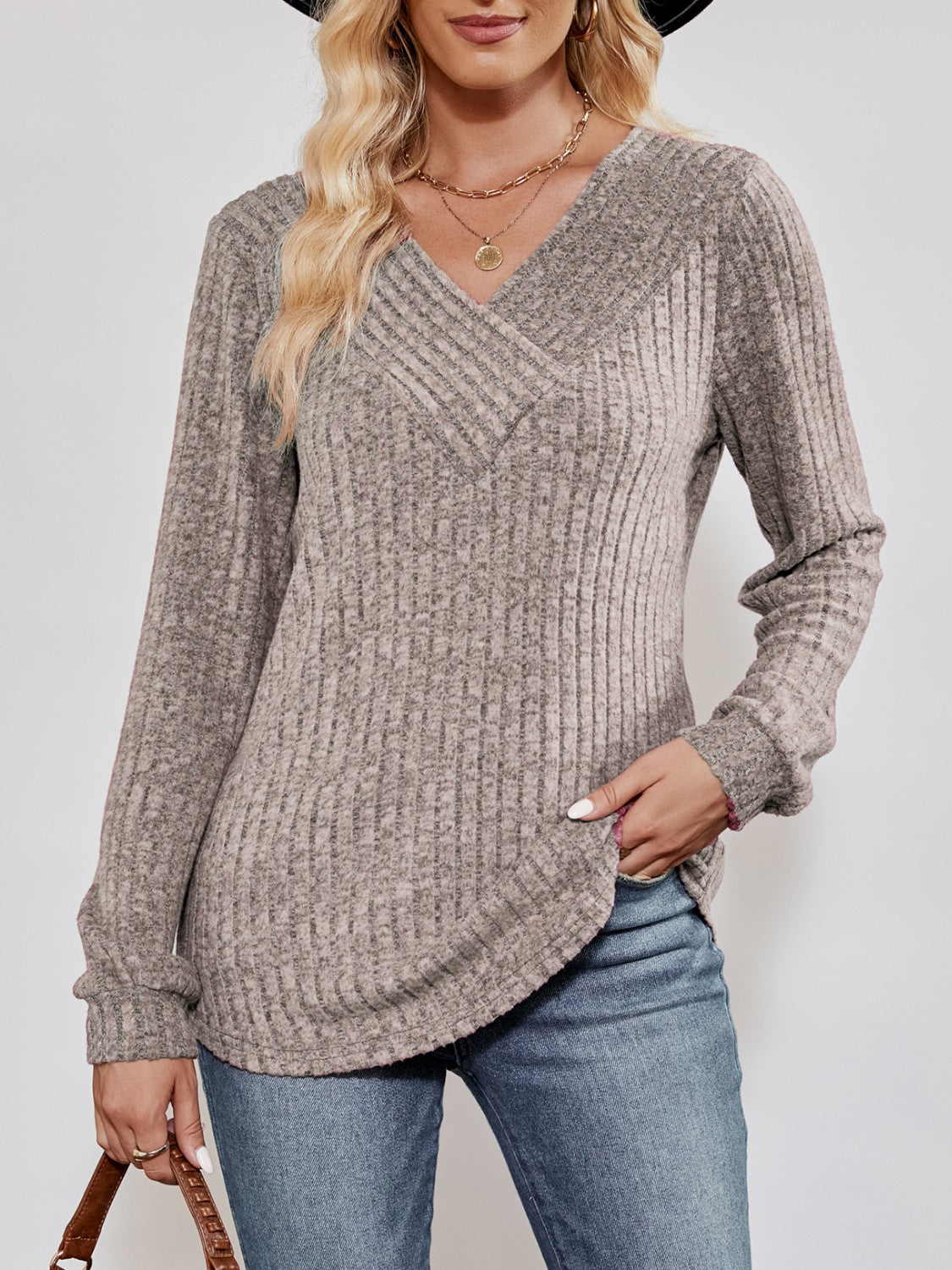 Textured ribbed V-neck pullover sweater in heathered taupe with long sleeves.