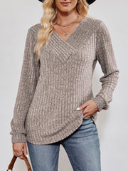 Textured ribbed V-neck pullover sweater in heathered taupe with long sleeves.