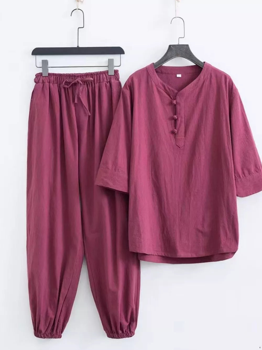 Relaxed fit men's Chinese-inspired pants set in deep purple, featuring a drawstring waist and button-up neckline.