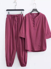 Relaxed fit men's Chinese-inspired pants set in deep purple, featuring a drawstring waist and button-up neckline.
