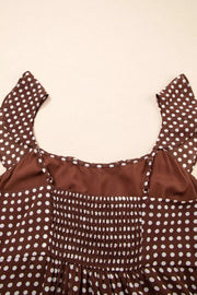 Brown polka dot maxi dress with smocked bodice and ruffled sleeves.