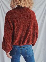 Terracotta textured ribbed knit relaxed crewneck pullover sweater with balloon sleeves.