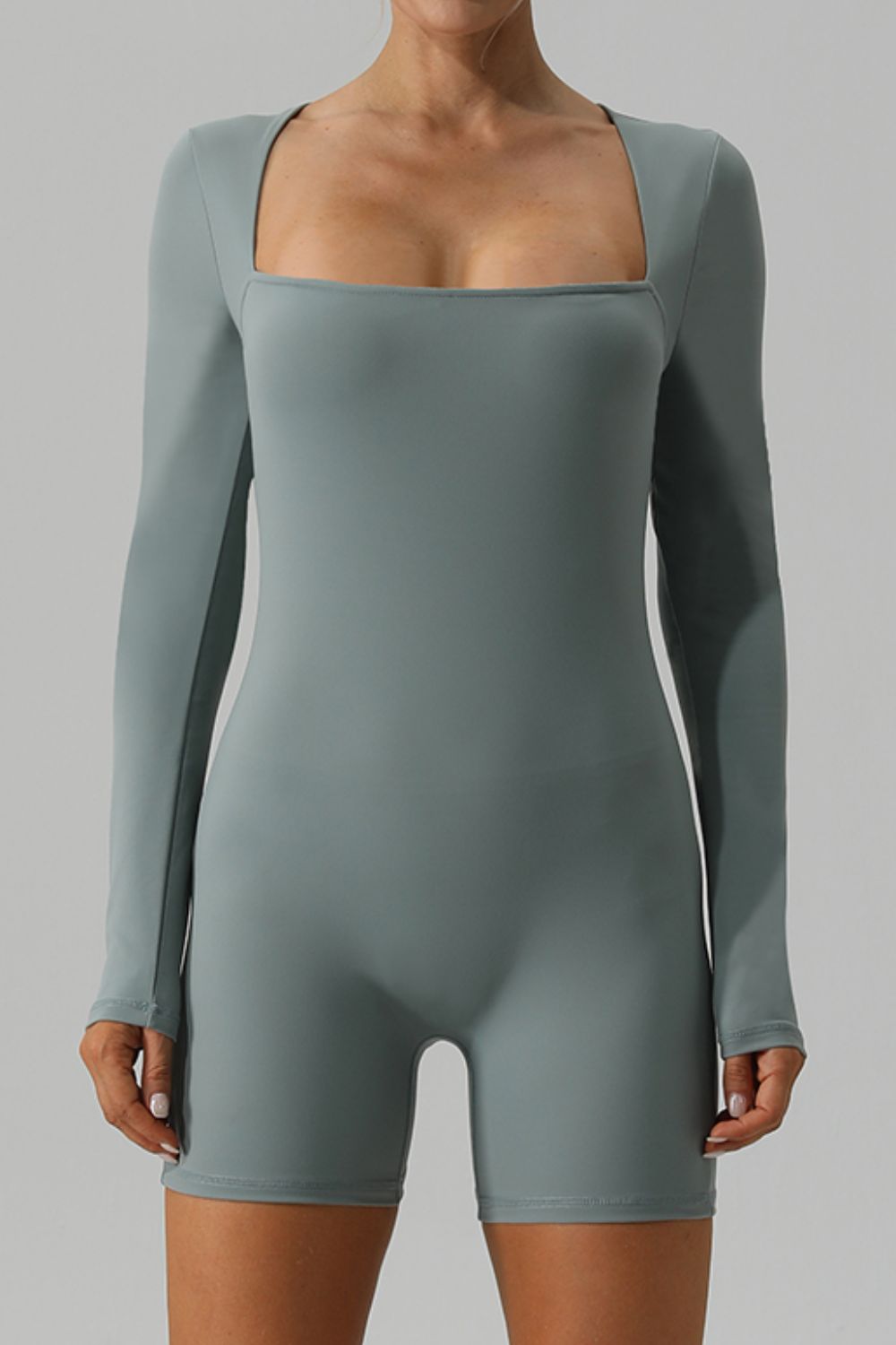 Light green long sleeve unitard with square neckline and short legs