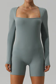 Light green long sleeve unitard with square neckline and short legs