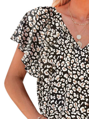 Black leopard print polyester blouse with flutter sleeves and V-neck.