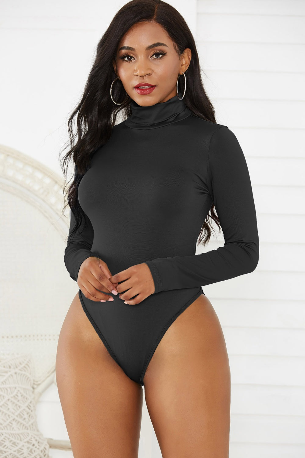Black long sleeve turtleneck thong bodysuit with a smooth finish.