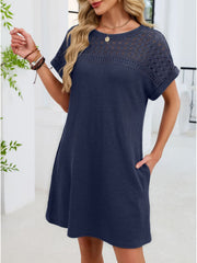Navy blue t-shirt dress with short sleeves and a sheer lace yoke detail.