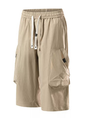 Khaki cargo capris with adjustable drawstring and large side pockets.
