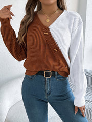 Asymmetrical colorblock knit sweater in brown and white with button detail.