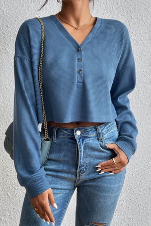 Dusty blue waffle knit henley crop top with button detail and long sleeves
