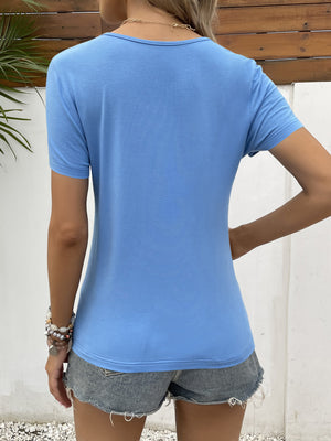 Blue short sleeve tee with scoop neck and lace trim detail.