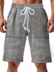 Men's grey quilted texture chino shorts with drawstring and diamond pattern.