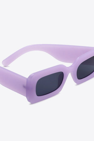 Lavender acetate rectangle sunglasses with dark lenses and thick frames.
