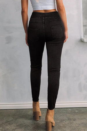 Dark sculpted denim jeggings with faux pockets and a high waist.